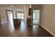 Open-concept living room with hardwood flooring and a view of kitchen island and entry way at 3908 Shelleydale Dr, Powder Springs, GA 30127