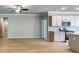 Spacious living area with hardwood floors, stainless steel appliances, and ample lighting create a modern and inviting space at 3908 Shelleydale Dr, Powder Springs, GA 30127