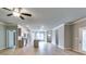 Open living space with hardwood floors, modern lighting, and seamlessly connected kitchen makes for an inviting atmosphere at 3908 Shelleydale Dr, Powder Springs, GA 30127