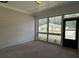 Relaxing covered porch with screened windows overlooking the property's landscape at 3908 Shelleydale Dr, Powder Springs, GA 30127
