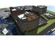 An aerial view showing the rear of the buildings including a terrace with furniture and a parking garage at 120 N Main St # 2A, Alpharetta, GA 30009