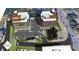 A vibrant aerial view of the mixed-use development showcasing the building exteriors and parking area at 120 N Main St # 2A, Alpharetta, GA 30009