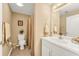 A charming bathroom featuring neutral paint, a white vanity, a toilet, and a shower with a decorative curtain at 1455 Oglethorpe Run Ln, Suwanee, GA 30024