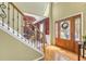 Grand foyer showcasing hardwood floors, a decorative staircase, and an elegant front door at 1455 Oglethorpe Run Ln, Suwanee, GA 30024