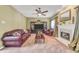 Inviting living room features a fireplace, built-in entertainment center, and comfortable leather furniture at 1455 Oglethorpe Run Ln, Suwanee, GA 30024