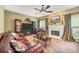 Cozy living room with a fireplace, plush leather furniture, and neutral décor at 1455 Oglethorpe Run Ln, Suwanee, GA 30024
