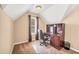 Home office with a desk, rolling chair and window, creating an ideal space for work and study at 1455 Oglethorpe Run Ln, Suwanee, GA 30024
