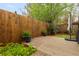 Cozy backyard with a wooden fence, patio area, and lush greenery offering privacy and a serene outdoor setting at 3065 Windcrest Ct, Alpharetta, GA 30022