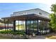 Exterior of a modern Starbucks featuring outdoor seating and clean architectural lines offering a convenient coffee spot at 3065 Windcrest Ct, Alpharetta, GA 30022