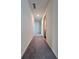 Neutral-colored hallway with carpet and access to other rooms at 7754 Sudbury Cir, Covington, GA 30014