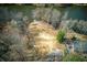Expansive waterfront lot with a dock and access to the lake, viewed from above in a scenic aerial shot at 1280 Tynecastle Way, Sandy Springs, GA 30350