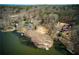 An aerial view capturing lakefront property with lush trees at 1280 Tynecastle Way, Sandy Springs, GA 30350