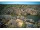 Panoramic aerial shot showcasing the property's location on a tranquil lake surrounded by natural beauty and other homes at 1280 Tynecastle Way, Sandy Springs, GA 30350