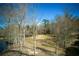 Expansive lakefront backyard with mature trees, offering a peaceful waterfront setting at 1280 Tynecastle Way, Sandy Springs, GA 30350
