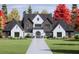 Stunning exterior with a symmetrical facade, manicured lawn and beautiful landscaping at 1280 Tynecastle Way, Sandy Springs, GA 30350