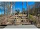 Stone steps lead from the dock up the landscape providing water and land access at 1280 Tynecastle Way, Sandy Springs, GA 30350