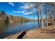 Beautiful lakefront view from the property's shoreline, offering serene and natural beauty at 1280 Tynecastle Way, Sandy Springs, GA 30350