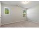 Bedroom with neutral carpet and walls, two windows provide natural light at 15 Sloane Ct, Covington, GA 30016