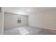 Spacious carpeted bedroom illuminated by natural light through a window with privacy blinds at 15 Sloane Ct, Covington, GA 30016