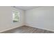 Cozy bedroom with a window that brings in natural light and neutral colored walls at 15 Sloane Ct, Covington, GA 30016