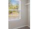 Walk-in closet with window and adjustable shelving for optimum organization at 15 Sloane Ct, Covington, GA 30016
