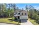 Charming two-story home with a two car garage, well-manicured lawn and a beautiful landscape at 15 Sloane Ct, Covington, GA 30016