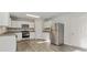 Open-concept kitchen with stainless steel appliances, granite countertops, and ample cabinetry at 15 Sloane Ct, Covington, GA 30016