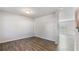 Sun-filled living room features wood-look floors and neutral paint at 15 Sloane Ct, Covington, GA 30016