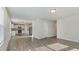 Open-concept living area seamlessly flows into the kitchen, with modern appliances and ample counter space at 15 Sloane Ct, Covington, GA 30016