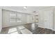 Spacious living room with natural light and modern wood look flooring at 15 Sloane Ct, Covington, GA 30016