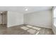 Bright and airy living room features wood-look floors and neutral walls at 15 Sloane Ct, Covington, GA 30016