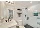 Bathroom featuring a glass enclosed shower, black and white accents and subway tile at 2376 Academy Ne Ct, Atlanta, GA 30345