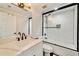 The updated bathroom has a white vanity, quartz countertop and subway tile shower with black accents at 2376 Academy Ne Ct, Atlanta, GA 30345