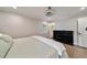 Primary bedroom features a ceiling fan, wood floors and plantation shutters at 2376 Academy Ne Ct, Atlanta, GA 30345