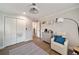 Bright and airy bedroom features modern décor, hardwood floors, and a sitting area at 2376 Academy Ne Ct, Atlanta, GA 30345