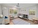 Cozy ' bedroom features hardwood floors, a gray crib, and ample natural light at 2376 Academy Ne Ct, Atlanta, GA 30345