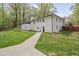 Bright white brick exterior with a well-maintained lawn and walkway leading to the back entrance at 2376 Academy Ne Ct, Atlanta, GA 30345