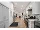Bright kitchen opens to the living room, and features white cabinets and stainless appliances at 2376 Academy Ne Ct, Atlanta, GA 30345