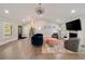 Spacious living room with ample natural light, hardwood floors, and a modern design, great for relaxing or socializing at 2376 Academy Ne Ct, Atlanta, GA 30345