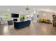 Open living space showcasing fireplace, kitchen, and dining areas, with hardwood flooring throughout at 2376 Academy Ne Ct, Atlanta, GA 30345