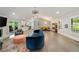 Spacious open-concept featuring fireplace, living, dining and kitchen areas filled with natural light at 2376 Academy Ne Ct, Atlanta, GA 30345