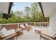 Outdoor patio has ample seating with cushioned chairs and views of the landscaped backyard at 2376 Academy Ne Ct, Atlanta, GA 30345