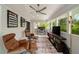 Sunroom with lounge chairs and entertainment center at 2376 Academy Ne Ct, Atlanta, GA 30345