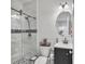Bathroom featuring modern fixtures, a glass shower, and a sleek vanity at 5372 Fountain Head Ln, Auburn, GA 30011
