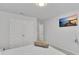 Comfortable bedroom featuring a wall-mounted TV and closet at 5372 Fountain Head Ln, Auburn, GA 30011