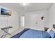 Bedroom with a wall-mounted TV, carpeted floors, and neutral walls at 5372 Fountain Head Ln, Auburn, GA 30011