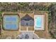 Aerial view of community amenities featuring pool, tennis courts, clubhouse, and parking at 5372 Fountain Head Ln, Auburn, GA 30011