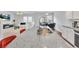 Open-concept kitchen with granite countertops overlooking the living and dining areas at 5372 Fountain Head Ln, Auburn, GA 30011