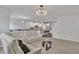 Open floor plan with a living room flowing into the kitchen, complete with modern finishes at 5372 Fountain Head Ln, Auburn, GA 30011