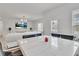 Open-concept living space with marble table, chairs, and hardwood floors at 5372 Fountain Head Ln, Auburn, GA 30011